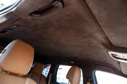 The ceiling of the SUV car pulled by brown soft material alkantara in the wor Photos