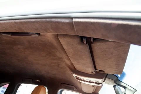 The ceiling of the SUV car pulled by brown soft material alkantara in the wor Photos