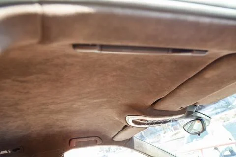 The ceiling of the SUV car pulled by brown soft material alkantara in the wor Photos