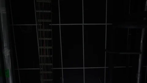 Ceiling in a technical room with wires lamps and pipes Stock Footage 91586192