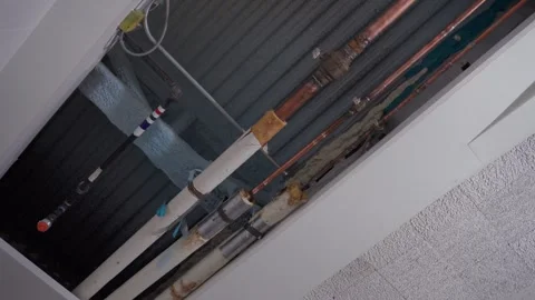 Ceiling Utility Pipes and Cables in Access Opening Stock Footage 314082041