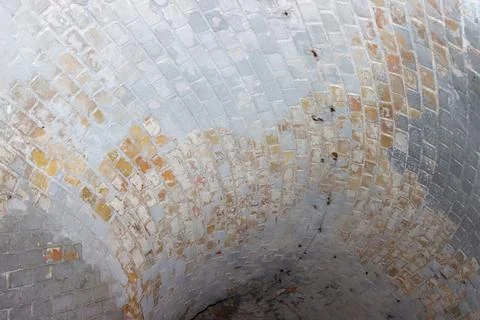 Ceiling vault lined with bricks in a medieval fortress. Stock Photos