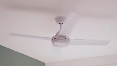 Ceiling ventilator functioning,blowing. Cooling down room , house in summer hot Stock Footage 246493178