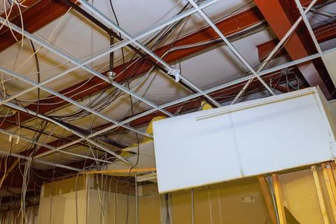 Ceiling works within construction complex encompass removal of old ceiling Stock Photos