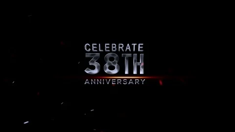 Celebrate 38th anniversary with silver text and red light on dark background Video stock 343668877