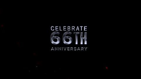 Celebrate 66th anniversary with silver text on black background with confett Video stock 343669063