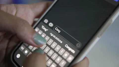 Celebrate with a smartphone message Stock Footage 278800413