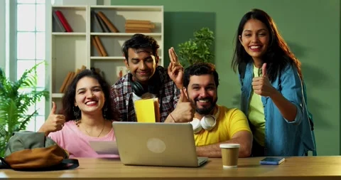Celebrating assignment success, Indian students study together using laptop Stock Footage 342383168