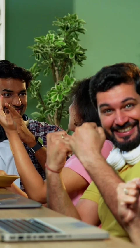 Celebrating assignment success, Indian students study together using laptop Stock Footage 342385039