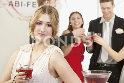 Celebrating graduation ceremony in front of young woman Stock Photos