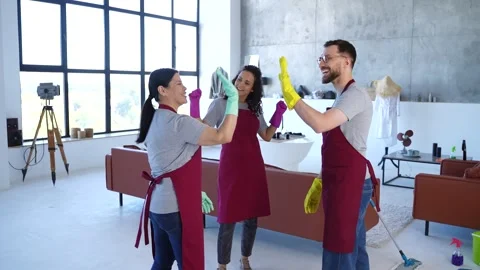 Celebrating great teamwork after cleaning done Stock Footage 279492918
