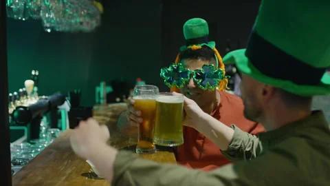 Celebrating St Patricks Day with Beer at Bar Counter Stock Footage 261512752