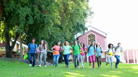 Celebrating students running and throwing books away together Stock Footage