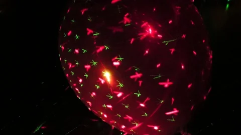 Celebration balloon laser reflections Stock Footage 71542915