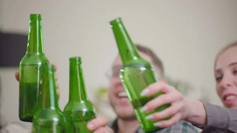 Celebration beer cheers concept, hands holding up bottles beer people group in Stock Footage 196011045