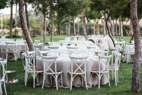 Celebration decorations on wedding in outdoor restaurant Stock Photos