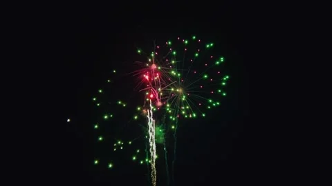Celebration With Firework Display Lighting up the Night Sky in Vibrant Colors Stock Footage 320841570