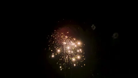 Celebration firework explosion creating glowing pattern in darkness Stock Footage 321282529