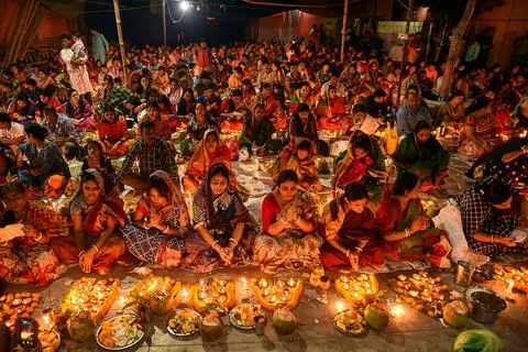 Celebration of lights with devotees performing rituals during Rakh festival. Stock Photos