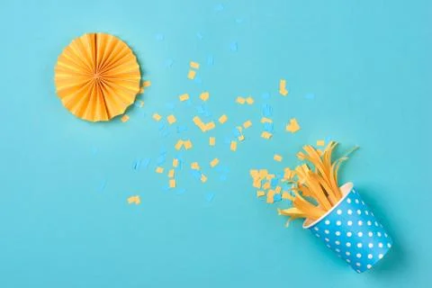 Celebration pattern with various party confetti on blue background. Flat lay Stock Photos