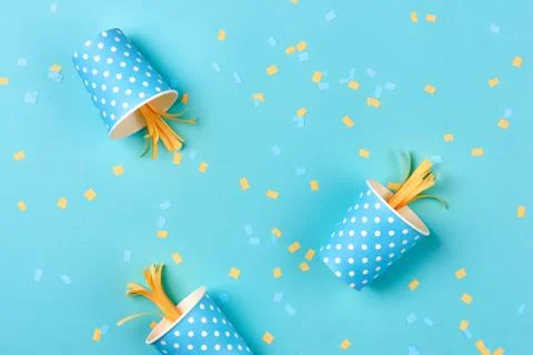 Celebration pattern with various party confetti on blue background. Flat lay Stock Photos