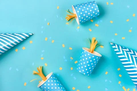 Celebration pattern with various party confetti on blue background. Flat lay Stock Photos