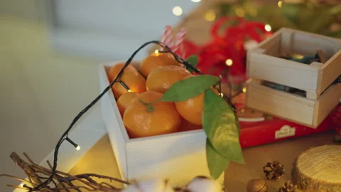 Celebratory display of oranges and decorations. Christmas themed arrangement Stock Footage 333299945