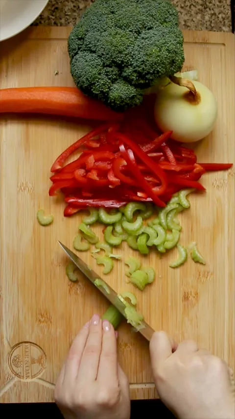 Celery being chopped into small pieces Stock Footage 303722631