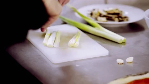 Celery close up being cut by chef on table Stock-Footage 166919311