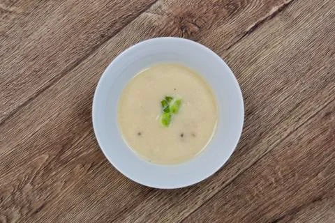 Celery cream soup on a table 스톡 사진