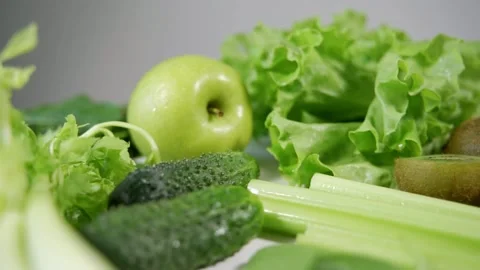 Celery, cucumbers, bright green apples close-up. Ingredients for making a fruit Video stock 160657968