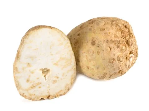 Celery root and its half isolated on white background. Close-up. Stock Photos