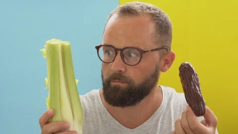 Celery vs cake Stock Footage 110709933