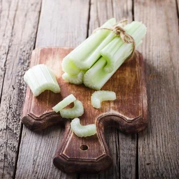 Celery,chopped on a wooden Board.selective focus Stock Photos
