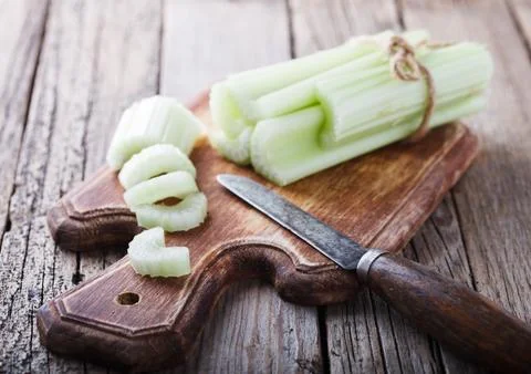 Celery,chopped on a wooden Board.selective focus Stock Photos