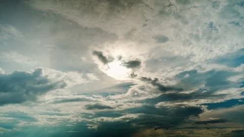 A celestial chronicle of a cloudy sky with a bright daytime sun and soft clouds. Stock Footage 337564780
