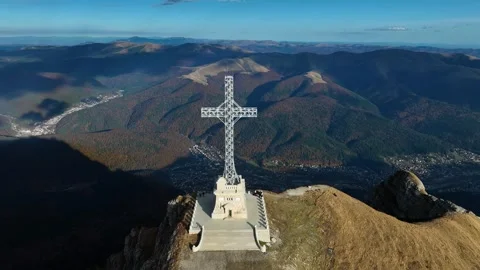 A Celestial Cross. The Caraiman Cross Soaring Above the Bucegi Mountains. Slow M Stock Footage 286375100