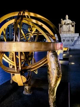 Celestial Globe (foreground) and the Statue of King Sejong the Great Stock Photos