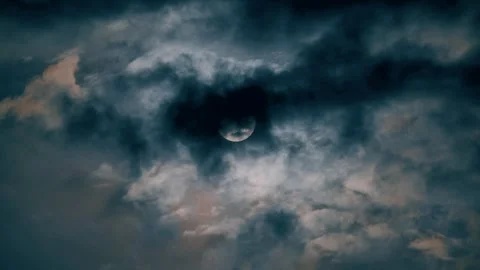Celestial Hide-and-Seek: Sun Peeking Through Clouds. Stock Footage 282540595