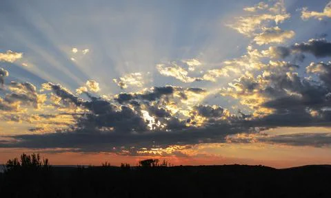 Celestial landscape with diffraction of the sun's rays during sunrise. Stock Photos