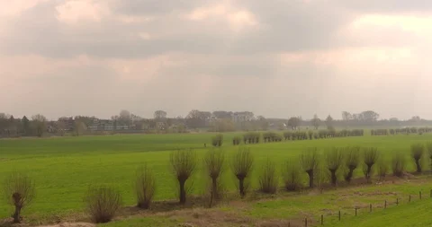 Celestial rays above fluvial landscape river IJssel Stock Footage 105787041