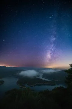 Celestial Reflection: Milky Way over Crocodile Island Lake. Stock Photos