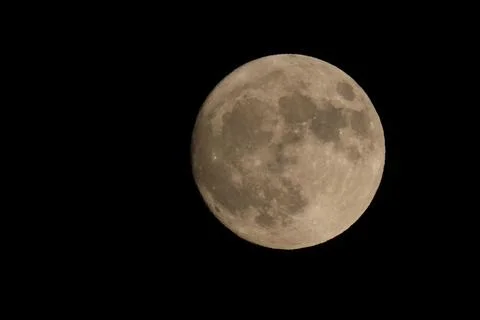Celestial scene of a full moon illuminated against a night sky Fotos Stock