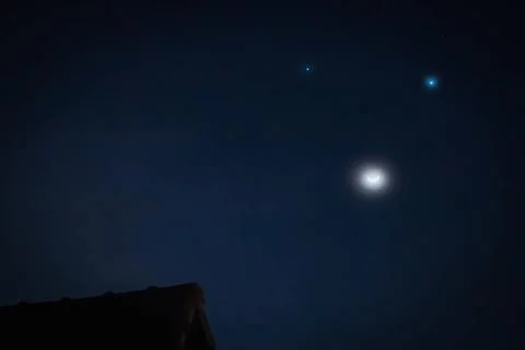  Celestial triangle The phenomenon Celestial triangle: Moon, Venus and Jup... Fotos Stock