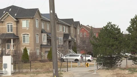 Cell phone and communications tower next to residential houses Stock Footage 151058351