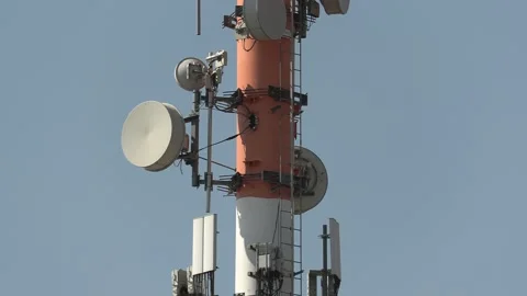 Cell phone and communications tower with radio antennas on it Video stock 151663787