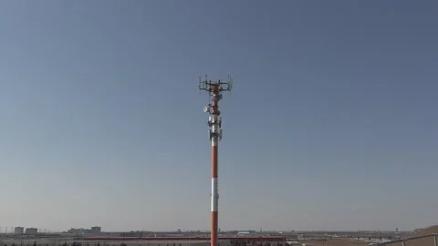 Cell phone and communications tower with radio antennas on it Vídeo Stock 151664139