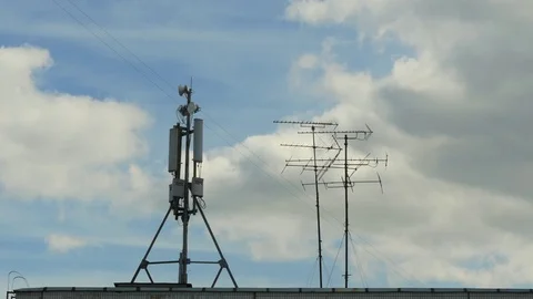Cell Phone Antenna And Clouds. Bird Fly Video stock 77587402