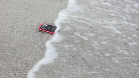 Cell Phone on Beach 1 Stock Footage 58837619