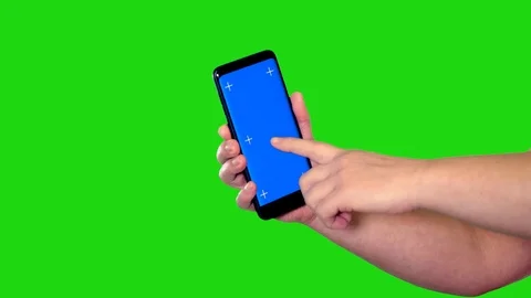 Cell phone with blue screen behind green screen 스톡 동영상 122390708